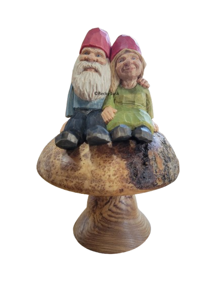 Nisse Couple Sitting On A Mushroom